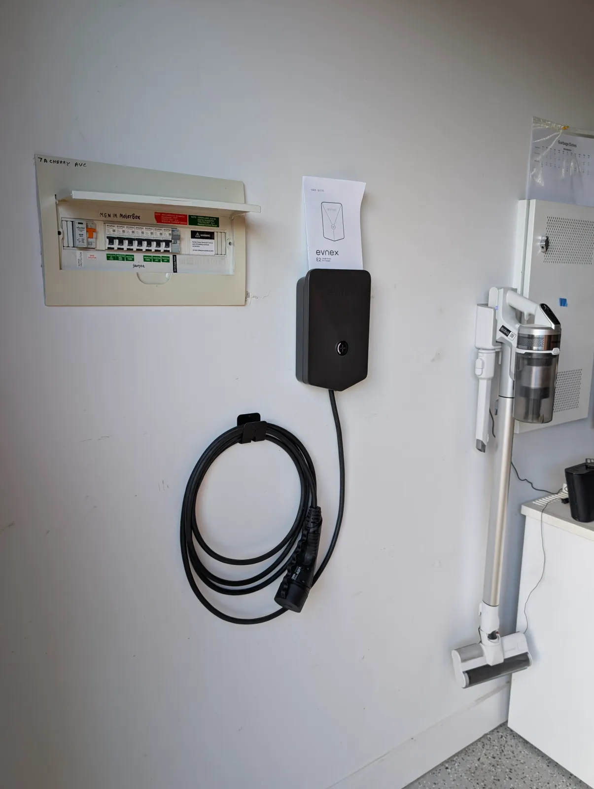 An EV charger and the switchboard it is wired back to