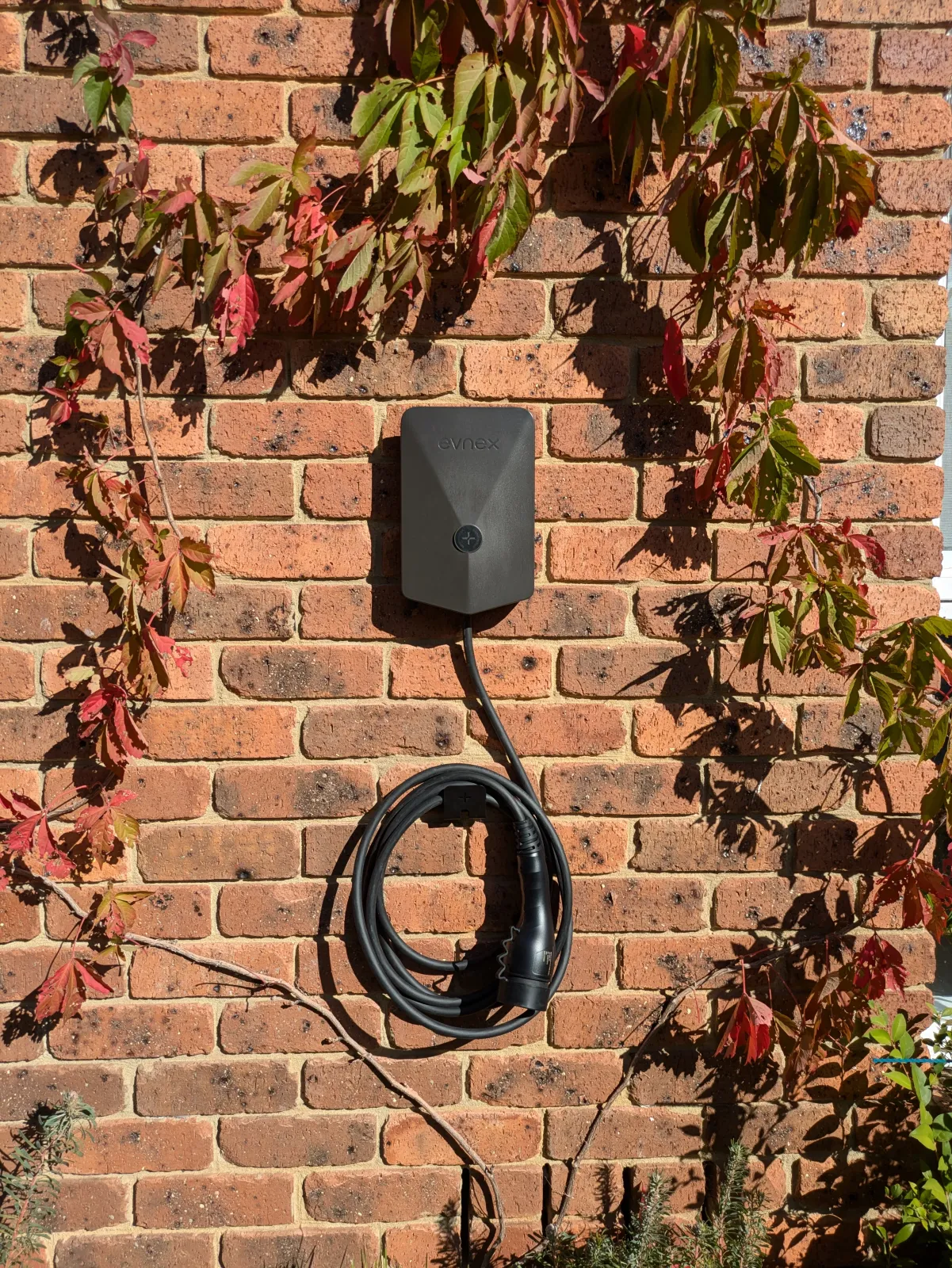 Wall charger on a brick facade