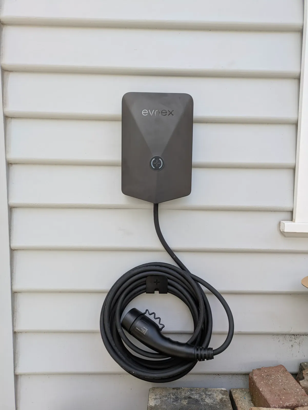 Evnex on a weatherboard wall