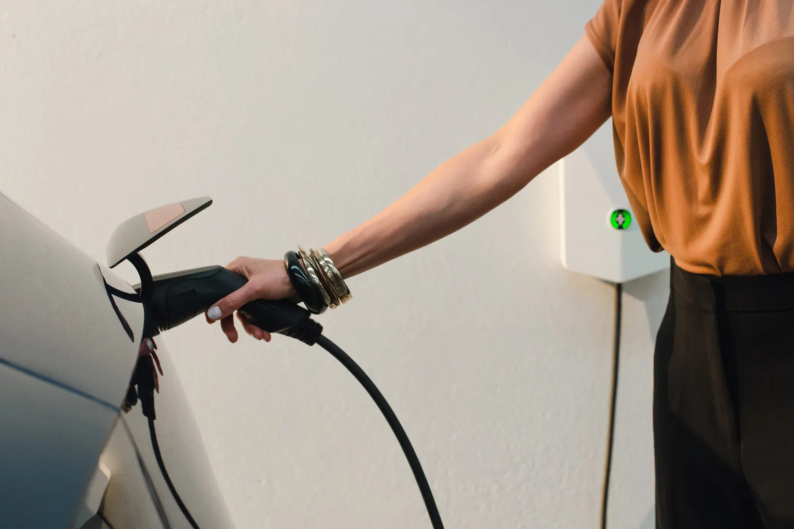 Single-phase home EV charger installed beside a garage