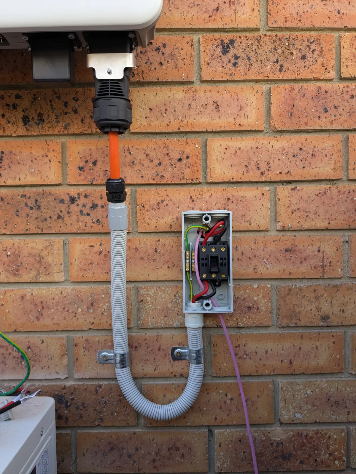 Water and power connections on a newly installed heat pump