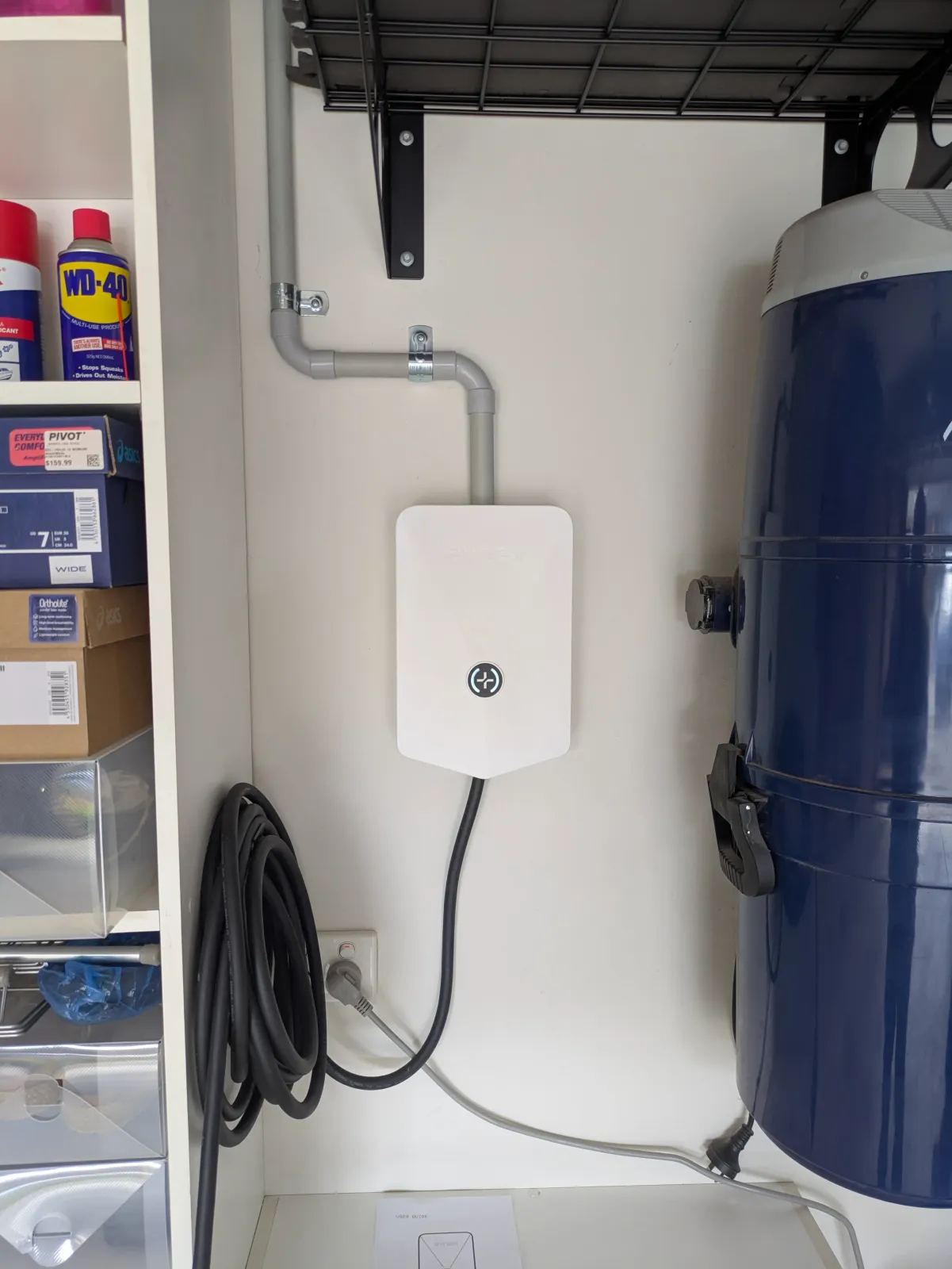 A garage heat pump install with the old gas unit removed